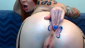 Redhead Webcam Model With Tattooed Body