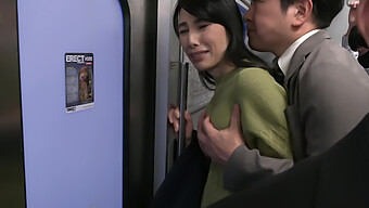 Japanese Mom Gets A Handjob In A Train